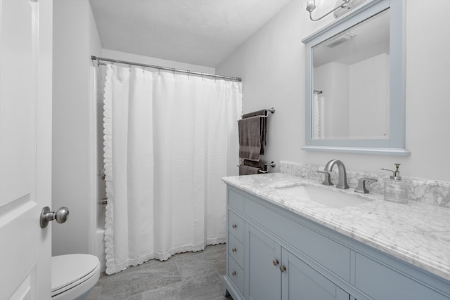 full bath featuring vanity, toilet, curtained shower, and marble finish floor