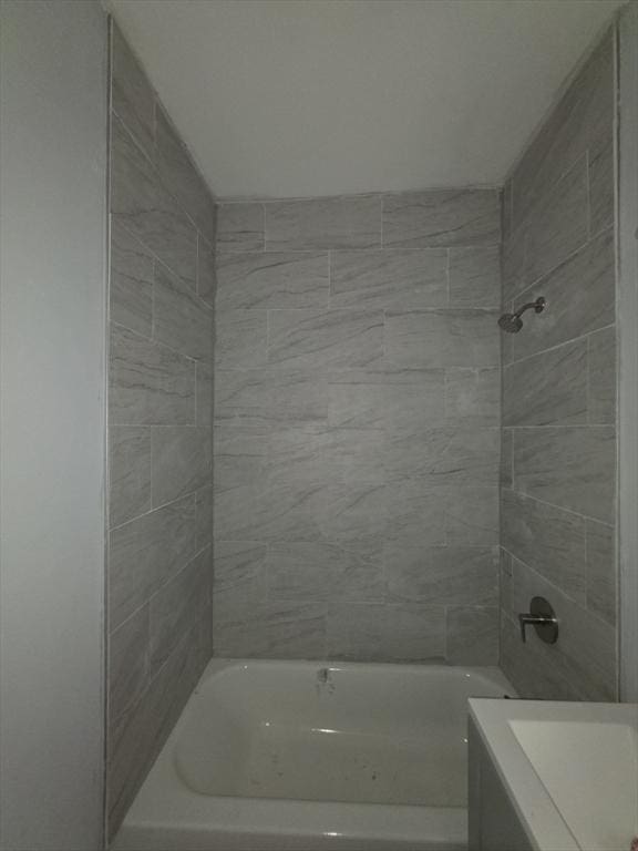 full bathroom with shower / washtub combination