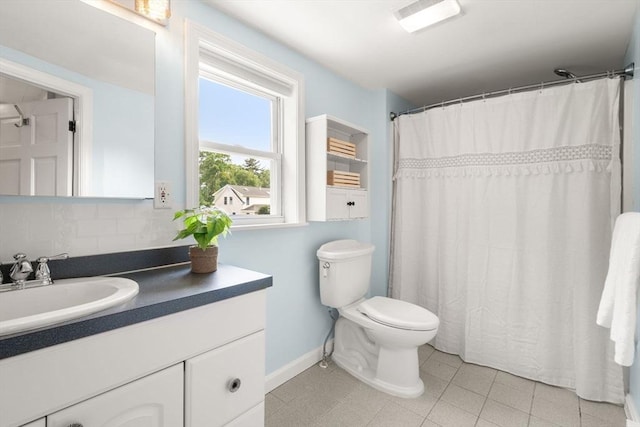 12 Fern St, Chelmsford, MA 01824 - bathroom featuring vanity and tasteful backsplash