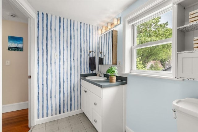 12 Fern St, Chelmsford, MA 01824 - bathroom featuring vanity, wallpapered walls, and tile patterned floors
