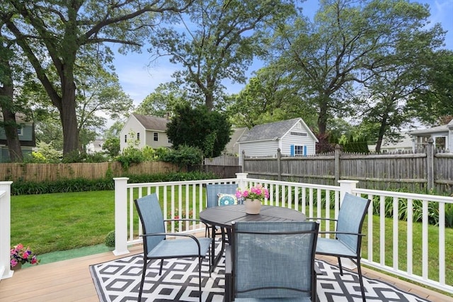 12 Fern St, Chelmsford, MA 01824 - wooden deck with outdoor dining area and a fenced backyard