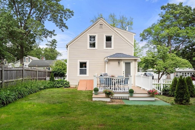 12 Fern St, Chelmsford, MA 01824 - back of property with a deck