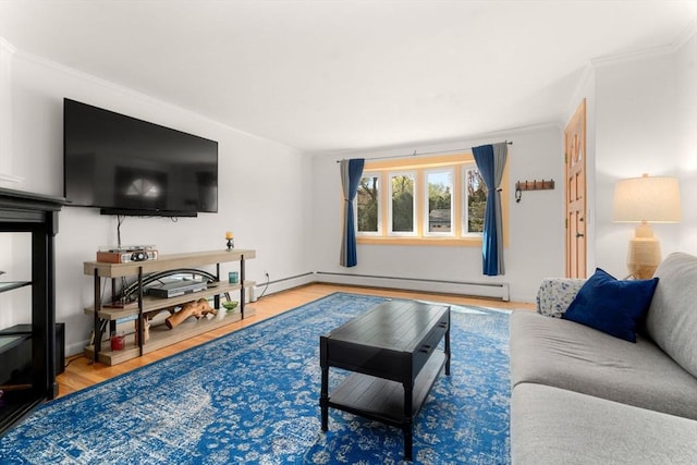 living area featuring crown molding, wood finished floors, and baseboard heating