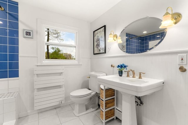 14 Melinda Ln, Easthampton, MA 01027 - bathroom with toilet, wainscoting, a sink, and tile patterned flooring