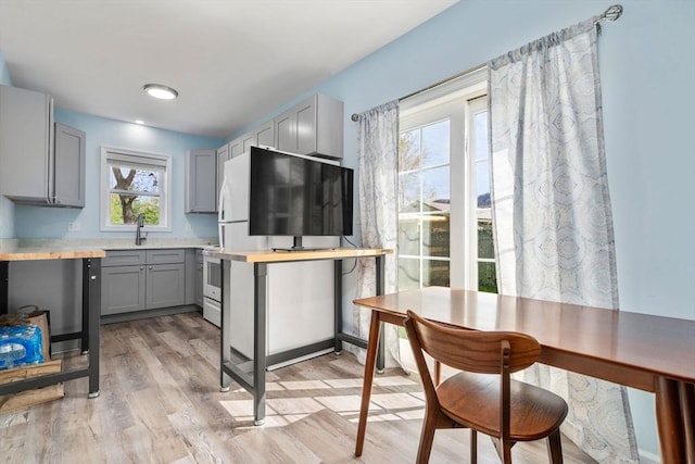 14 Melinda Ln, Easthampton, MA 01027 - bar with a sink and light wood-style floors