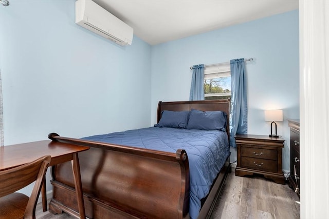 14 Melinda Ln, Easthampton, MA 01027 - bedroom with an AC wall unit and wood finished floors