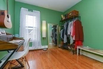mudroom with wood finished floors