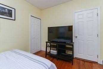 bedroom with wood finished floors