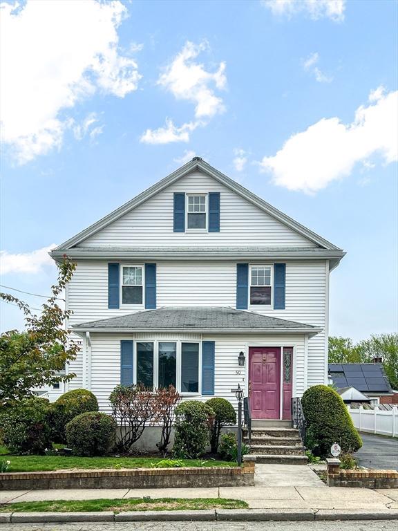 american foursquare style home featuring fence