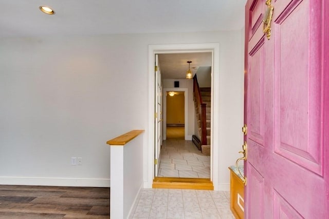 entrance foyer featuring stairs, recessed lighting, baseboards, and baseboard heating