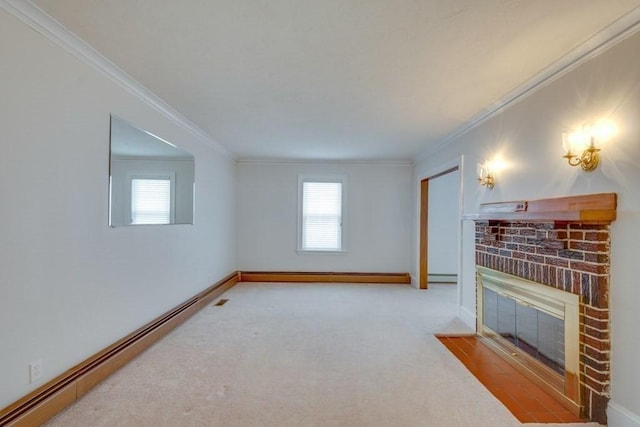 unfurnished living room featuring baseboard heating, a brick fireplace, ornamental molding, carpet flooring, and baseboards