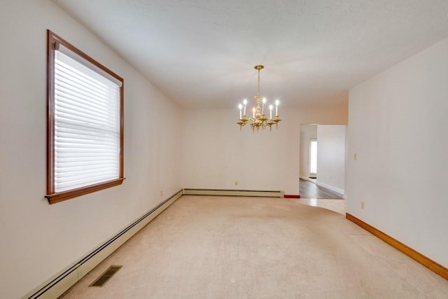 carpeted spare room with a chandelier, a baseboard heating unit, baseboards, and baseboard heating