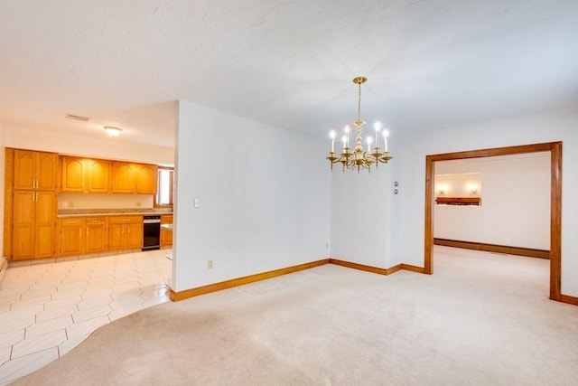 unfurnished dining area featuring a chandelier, light carpet, and baseboards