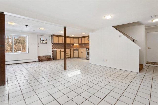 unfurnished living room with baseboard heating and light tile patterned floors