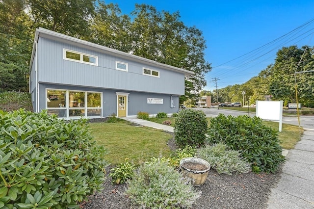 view of property with a front lawn