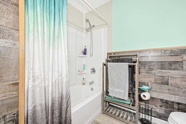 bathroom with toilet, shower / bath combination with curtain, and wood-type flooring