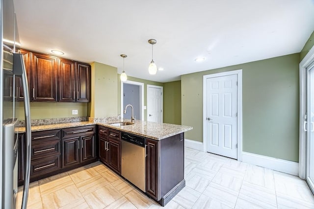 kitchen with appliances with stainless steel finishes, hanging light fixtures, sink, dark brown cabinetry, and kitchen peninsula