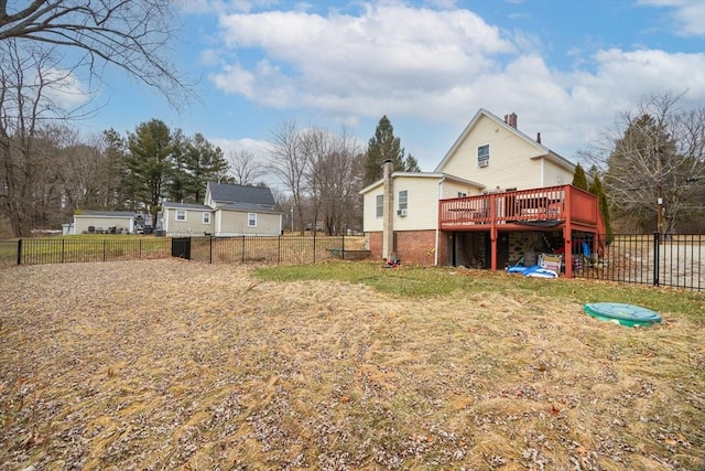 back of property with a wooden deck