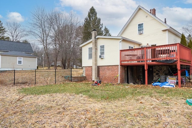 back of property with cooling unit and a wooden deck