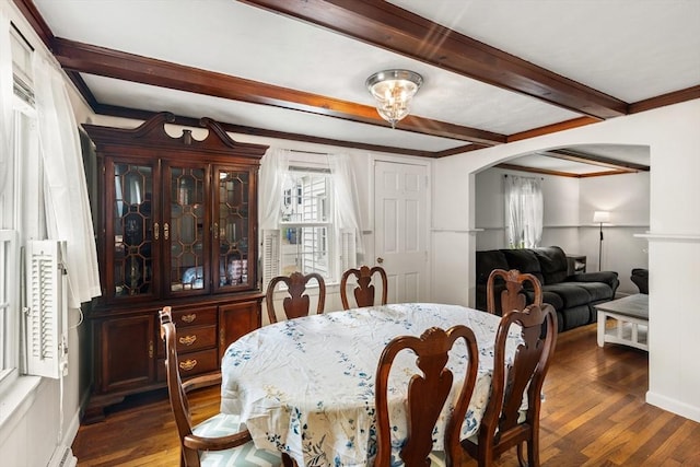 15 Dale St, Methuen, MA 01844 - dining space featuring arched walkways, wood finished floors, beamed ceiling, crown molding, and a baseboard radiator