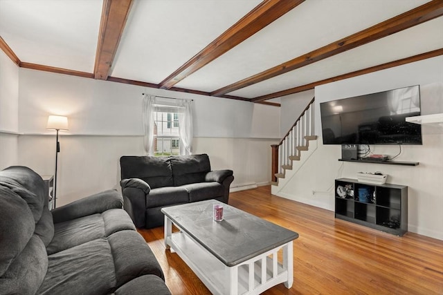 15 Dale St, Methuen, MA 01844 - living area with wood finished floors, stairs, beam ceiling, a baseboard radiator, and baseboards