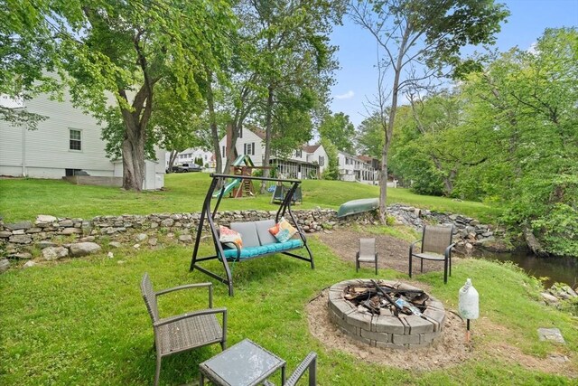 15 Dale St, Methuen, MA 01844 - view of green lawn with an outdoor fire pit and a playground