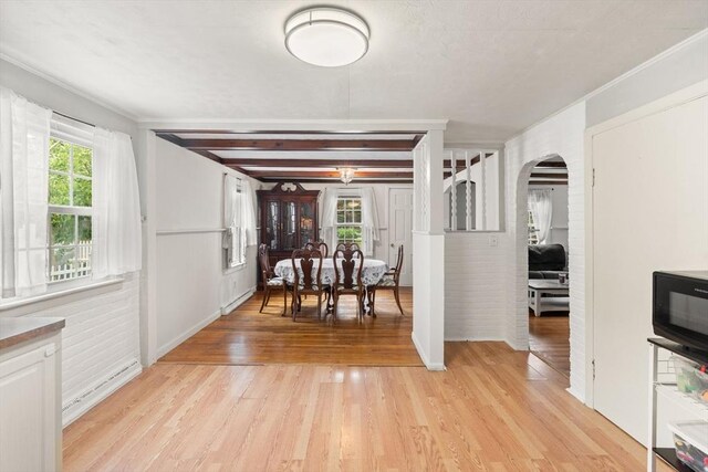 15 Dale St, Methuen, MA 01844 - dining space with arched walkways and light wood-type flooring