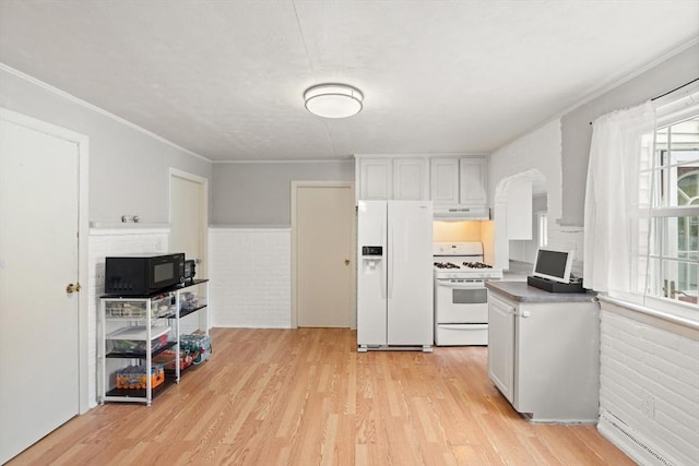15 Dale St, Methuen, MA 01844 - kitchen with white appliances, under cabinet range hood, light wood finished floors, white cabinetry, and a baseboard heating unit