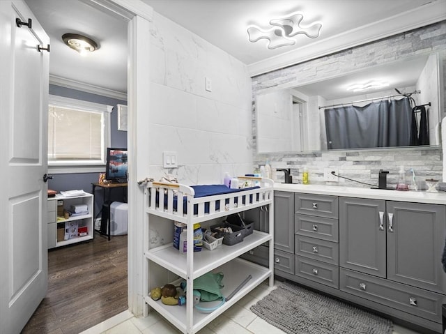22 2nd Ave, Leominster, MA 01453 - bathroom featuring double vanity, ornamental molding, and a shower with curtain