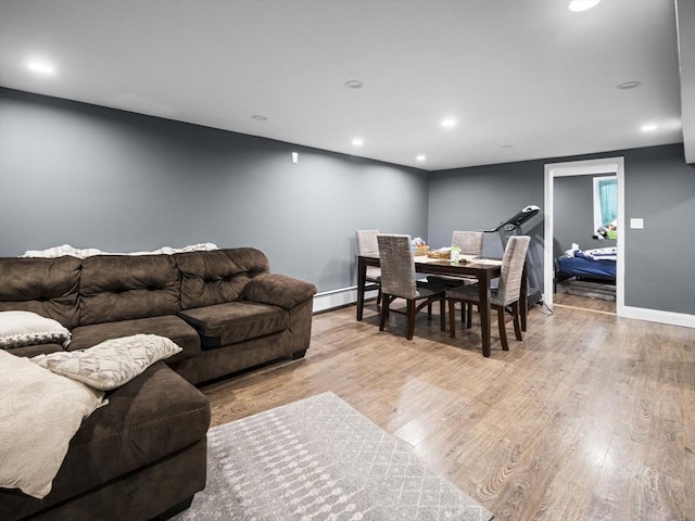 22 2nd Ave, Leominster, MA 01453 - living room with wood finished floors, a baseboard radiator, baseboards, and recessed lighting