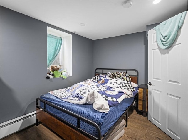 22 2nd Ave, Leominster, MA 01453 - bedroom featuring a baseboard radiator and wood finished floors