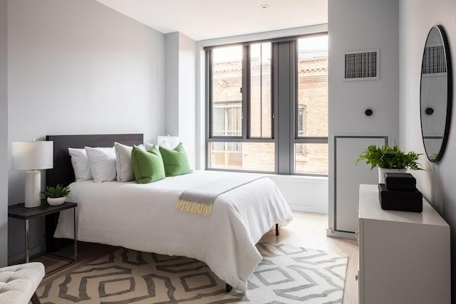 bedroom with light hardwood / wood-style floors