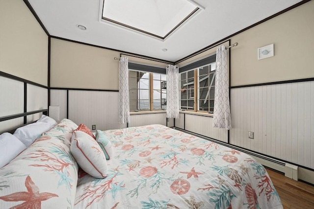 bedroom featuring crown molding and hardwood / wood-style floors