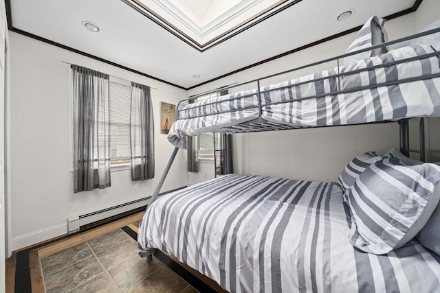 bedroom with crown molding and a baseboard radiator