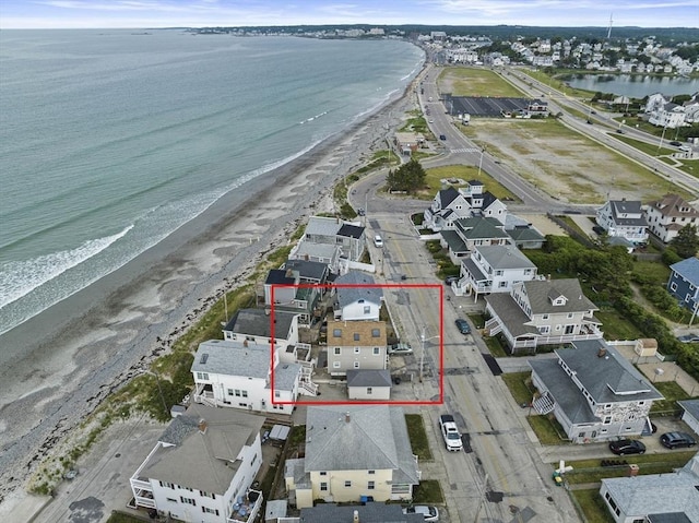 aerial view featuring a view of the beach and a water view