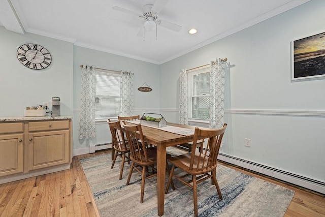 dining area with ceiling fan, a baseboard radiator, ornamental molding, and light hardwood / wood-style floors