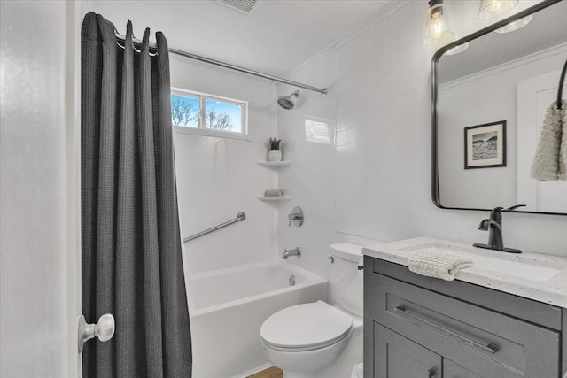 full bathroom with crown molding, toilet, shower / bath combo with shower curtain, and vanity