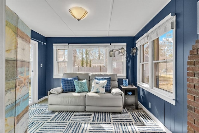 interior space with baseboards, carpet floors, and an outdoor hangout area