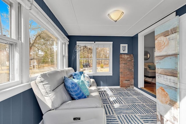 sunroom / solarium featuring a healthy amount of sunlight