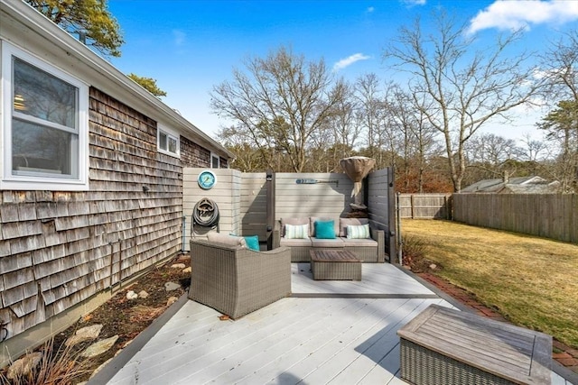 wooden deck featuring a fenced backyard and a yard