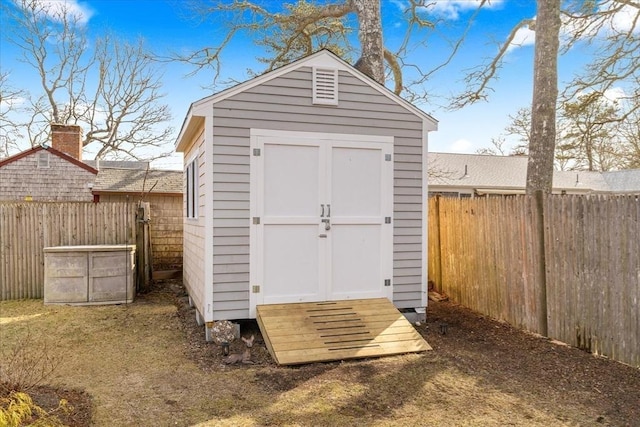 view of shed featuring a fenced backyard
