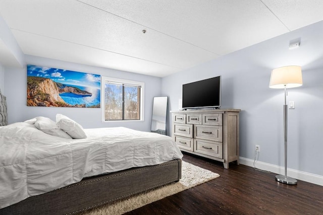 bedroom featuring dark hardwood / wood-style flooring