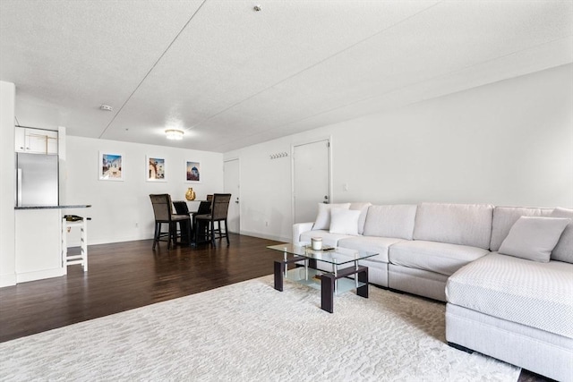 living room with dark wood-type flooring