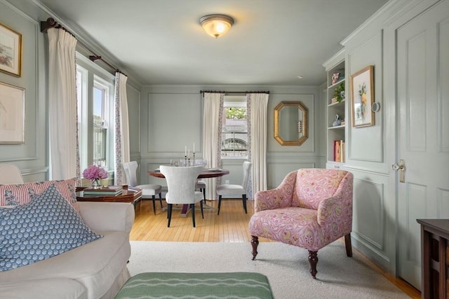 35 Ocean Ave Unit 3, Salem, MA 01970 - living area featuring a decorative wall, hardwood / wood-style floors, and crown molding