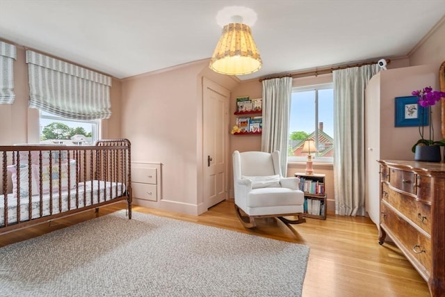 35 Ocean Ave Unit 3, Salem, MA 01970 - bedroom with light wood-style flooring and ornamental molding