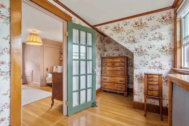 35 Ocean Ave Unit 3, Salem, MA 01970 - bedroom with crown molding, wallpapered walls, and light wood-type flooring