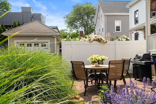 35 Ocean Ave Unit 3, Salem, MA 01970 - view of patio with grilling area, outdoor dining space, and a garage