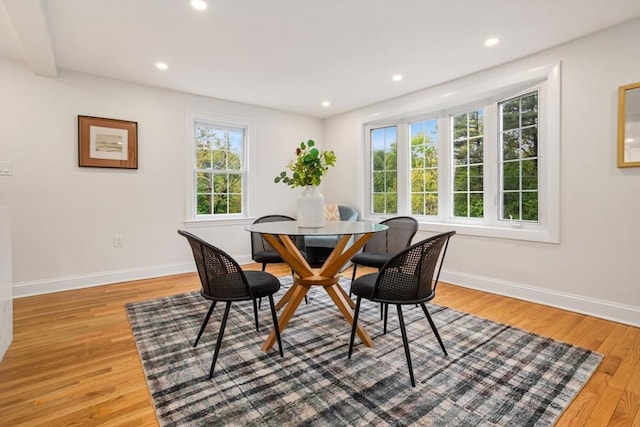 dining space with baseboards, light wood-style floors, and recessed lighting