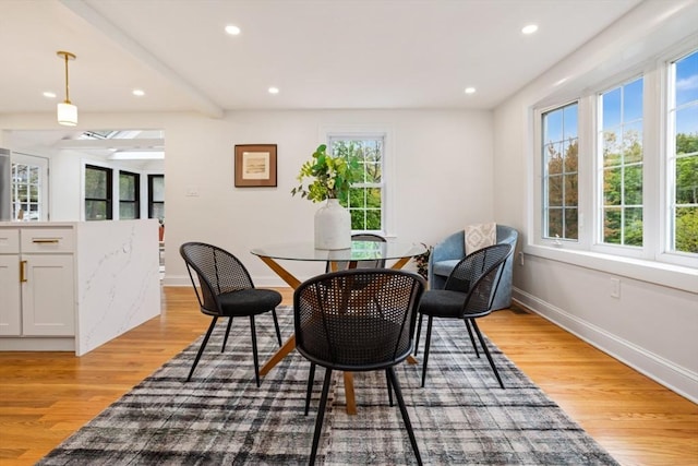dining space featuring light wood-type flooring, baseboards, and recessed lighting