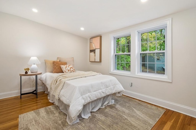 bedroom featuring recessed lighting, baseboards, and wood finished floors